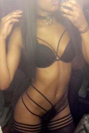 Eve showing off her body in black lingerie and hot black choker.